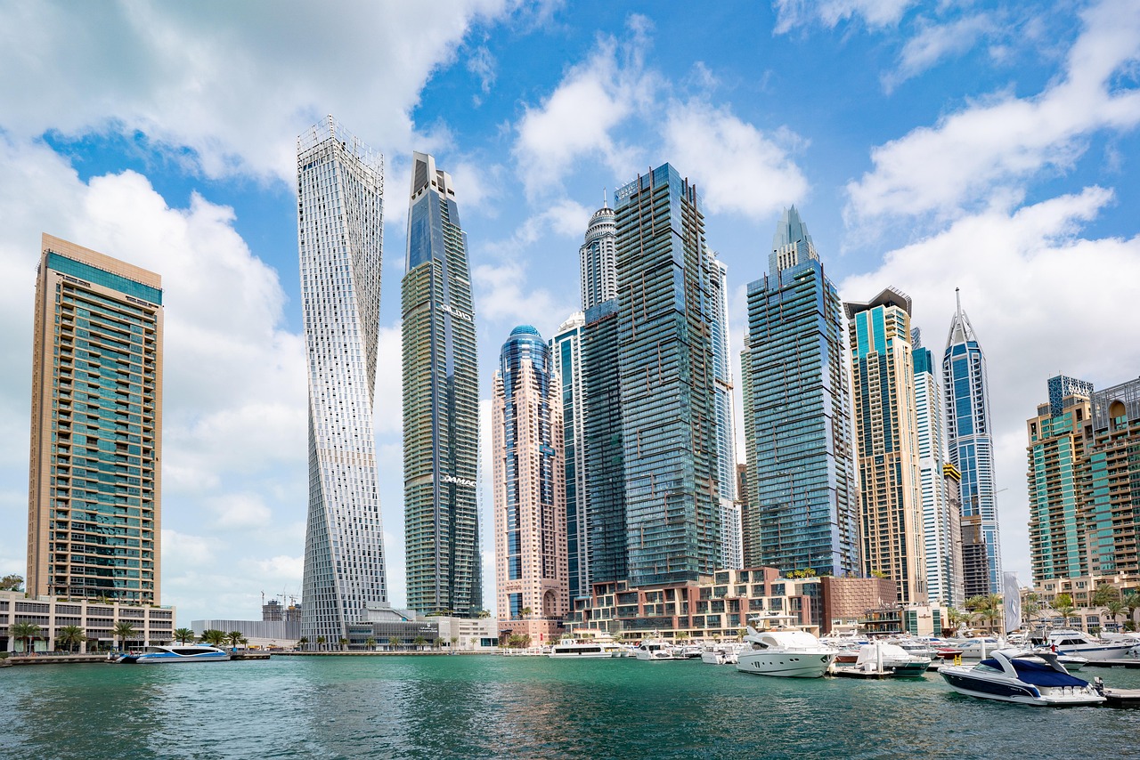 Business Bay Dubai skyline with modern high-rise towers along the Dubai Canal at sunset